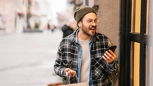 istock Happy man with shopping bags 2232963158