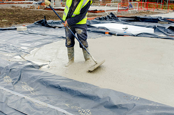 istock Concreters pouring floor slab from concrete mixer 2232963265