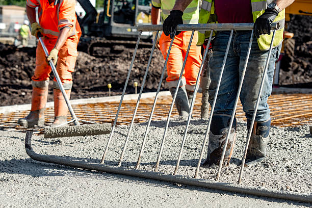 istock Concrete pouring process at a construction site with builders and concrete pump 2232965709