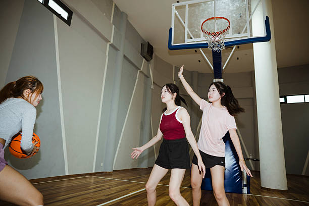 istock Friends playing basketball. 2232967248