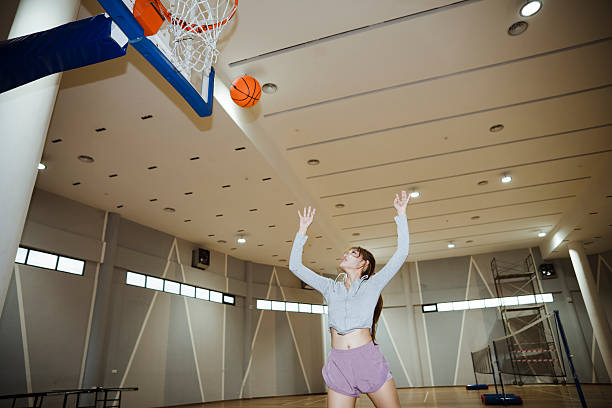istock Friends playing basketball. 2232967348