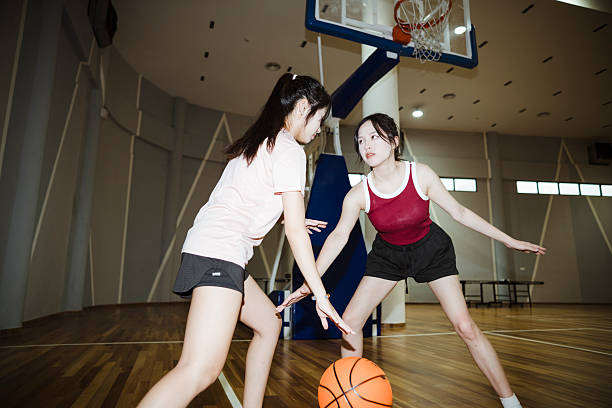 istock Friends playing basketball. 2232967394