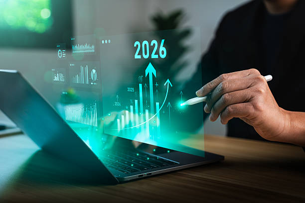 istock Businessman analyzing digital financial growth charts with upward trends and 2026 target, using laptop and stylus for strategic planning, investment forecasting, future business performance analysis 2232970921