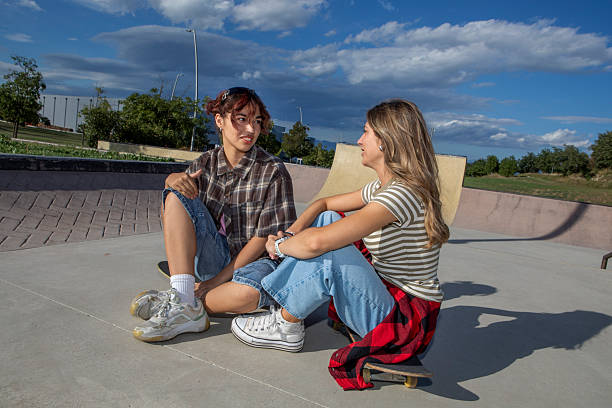 istock Two Young Women with Skateboards at Skatepark 2232974398