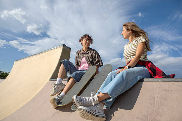 istock Two Young Women with Skateboards at Skatepark 2232974738