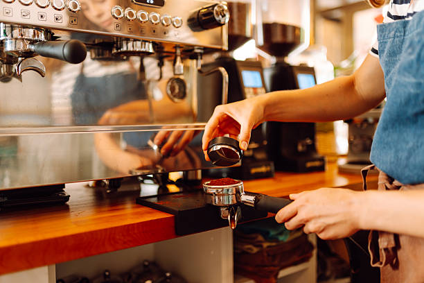 istock An experienced barista prepares aromatic coffee on a modern espresso machine. 2232974881