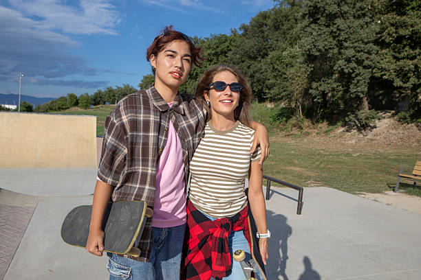 istock Two Young Women with Skateboards at Skatepark 2232976068