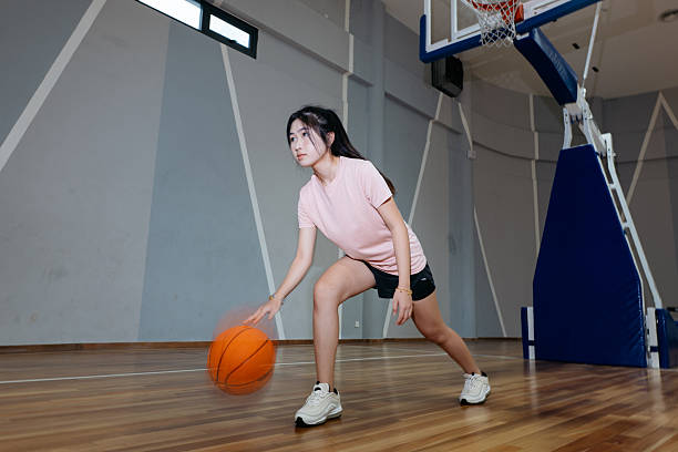 istock Friends playing basketball. 2232976342