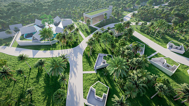 istock Aerial wide angle view 3D Render of a modern residential complex by the beach, featuring villas, glamping sites, tourist resort, bungalows, houses, restaurants, and common spaces, set within a green landscape with roads and white concrete buildings 2232977425