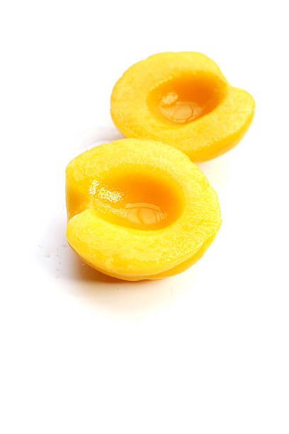 Peach halves in syrup. Fruity desserts