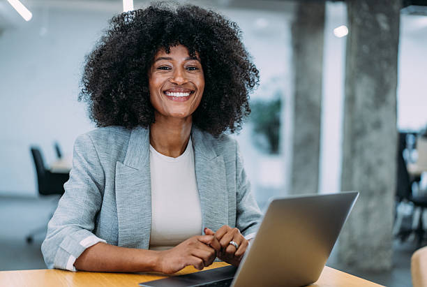 istock Successful businesswoman in modern office working on laptop. 2232980092