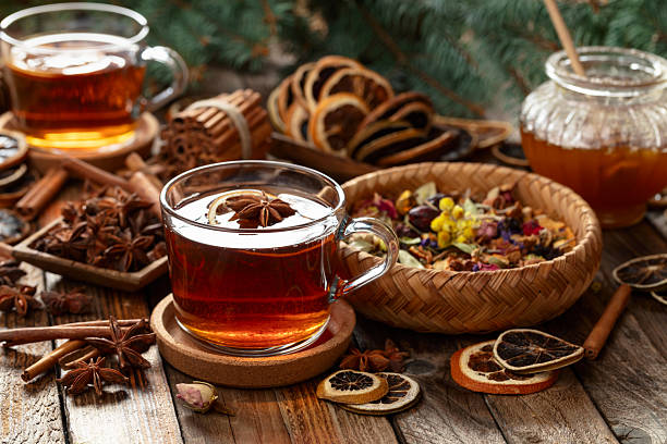 istock Christmas herbal tea with ingredients on a old wooden table. 2232983807