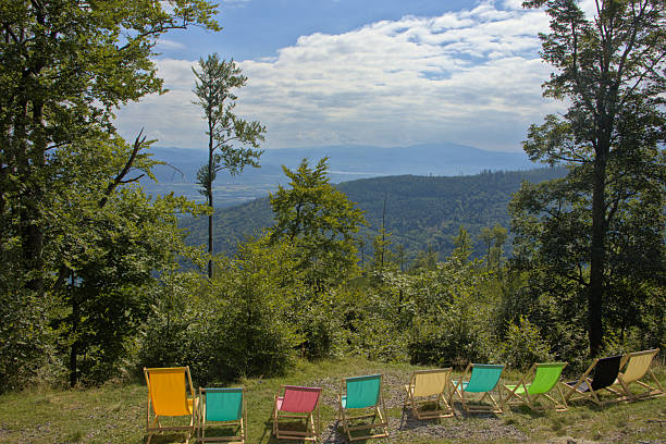 View of a countryside, mountains and an old armchair at sunset in summer (region Tzoumerka, Epirus, Greece).