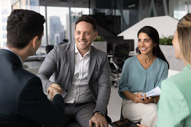 istock Two male colleagues shaking hands as gesture of mutual respect 2232984096