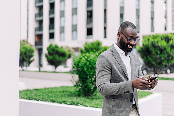 istock Businessman texting outdoors. 2232984234