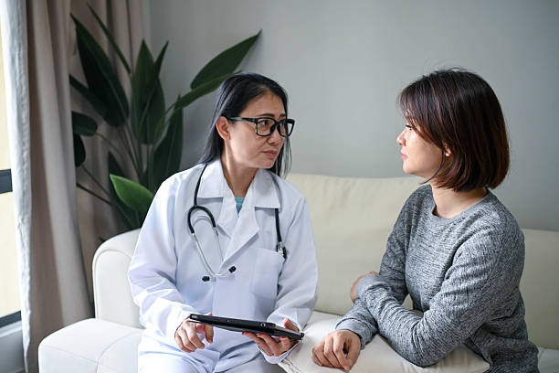 istock Caring Female Doctor Explaining Treatment Options to Patient 2232987672