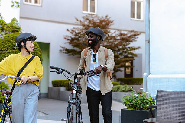 istock Two friends enjoying a conversation while biking outdoors in an urban setting 2232992284