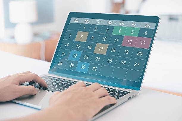 istock Digital calendar on laptop screen with highlighted dates, symbolizing schedule planning, time management, productivity, event organization, and efficient business or personal task scheduling. 2232994784