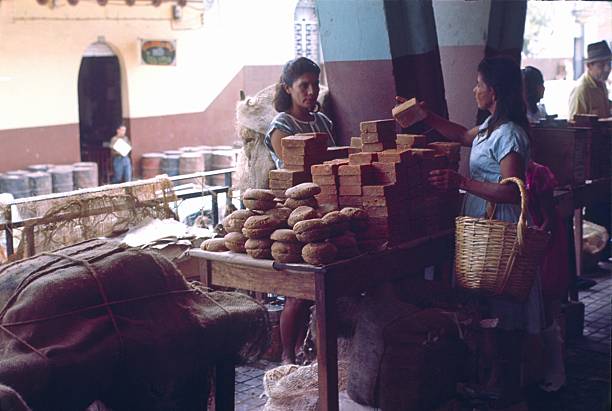 Girardot, Colombia, 1964. Soap seller and customer at a market stall in Girardot.
