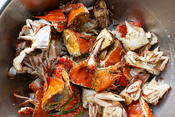 raw cooked crab on a white plate,close up