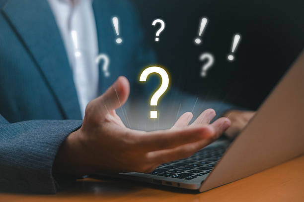 istock Businessman hand holding glowing question mark symbol with exclamation marks, representing uncertainty, decision making, problem solving, confusion, idea, and innovation concept. 2232999840