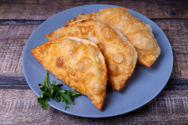 istock Chebureks with meat. Deep-fried flat pie. A traditional dish. Close-up. 2233000624