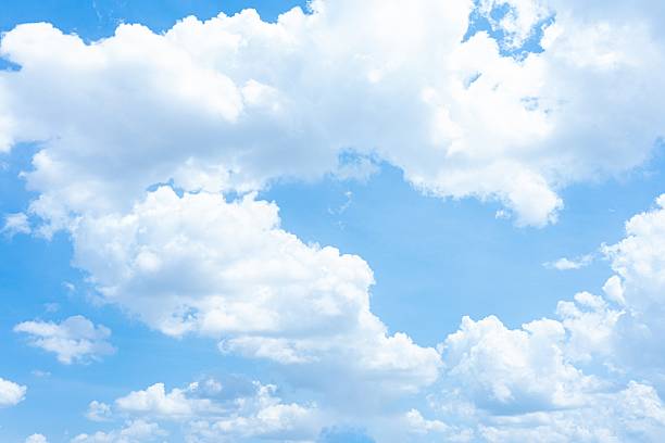 istock Blue sky with fluffy white cumulus clouds A daytime image showing scattered clouds 2233001634