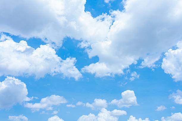 istock Blue sky with fluffy white cumulus clouds A bright sunny day with scattered clouds High resolution image 2233001641