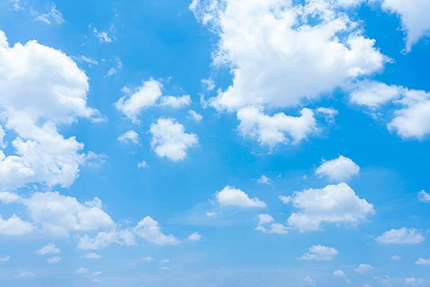 istock Vibrant blue sky filled with fluffy white cumulus clouds A scenic daytime sky with scattered cloud formations 2233001678