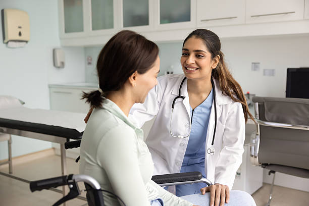 istock Positive caring young Indian doctor giving support 2233002534