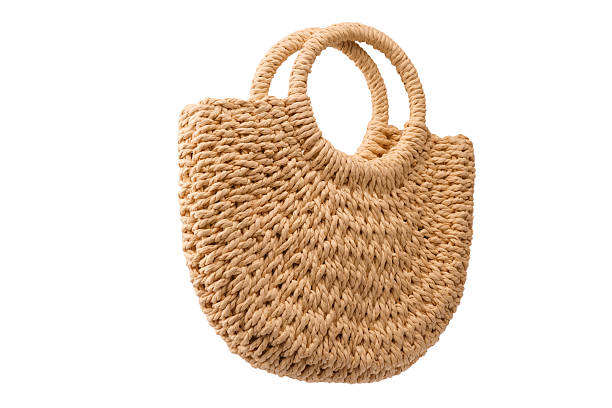 istock A beige straw bag isolated on a white background. 2233006765