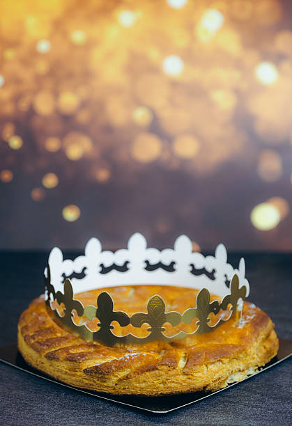 One almond royal galette with crown on table with bokeh.