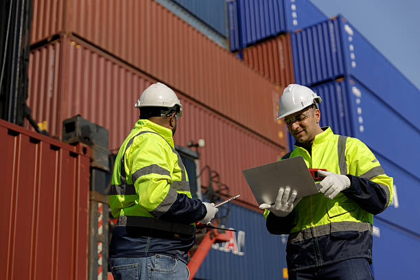istock Engineers inspect goods and containers for export by global businesses. 2233010397