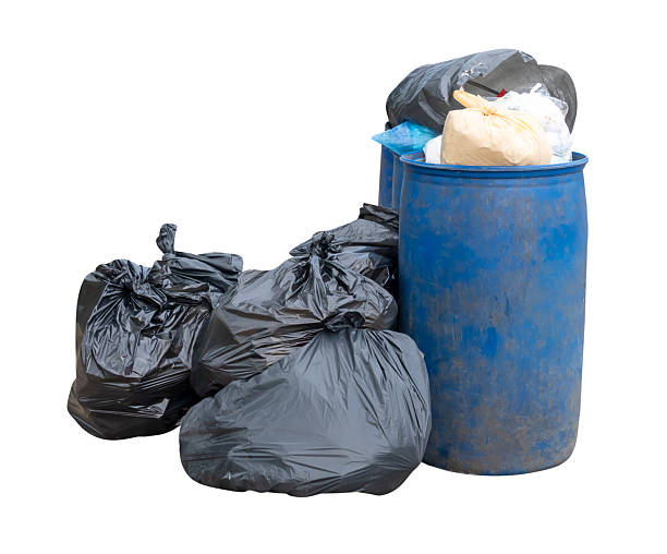 istock Garbage in black garbage bag and blue bins in stack at garbage dump isolated on white background with clipping path 2233015235