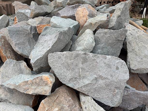 istock Pile of gray construction rocks for landscaping projects or geological studies showcasing texture surface geology minerals aggregate base raw material and earth tone shades 2233015289