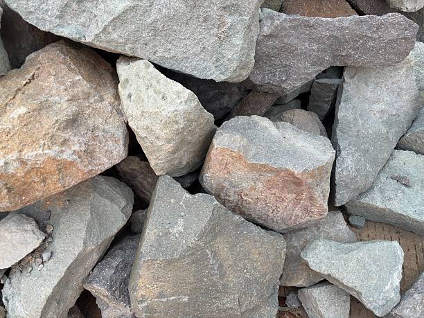 istock Raw stone pile textures, various sizes of natural rock formations, gray surface minerals, rough texture solid blocks, geological materials, stone pile for building foundations and walls 2233015318