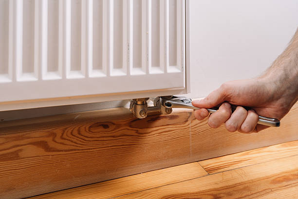 istock Maintenance of a radiator for efficient home heating in winter 2233015664