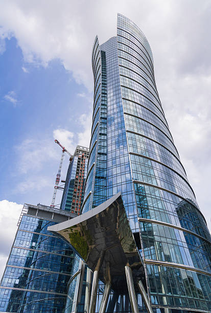 istock Modern skyscraper architecture with reflective glass panels under a blue sky 2233019542