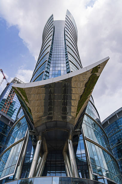 istock Modern skyscraper architecture with reflective glass panels under a blue sky 2233019544