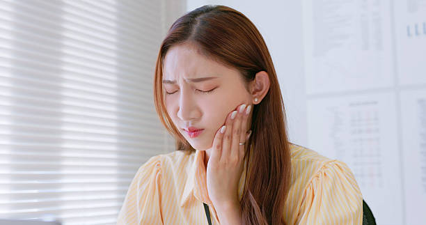 istock businesswoman has toothache 2233021435