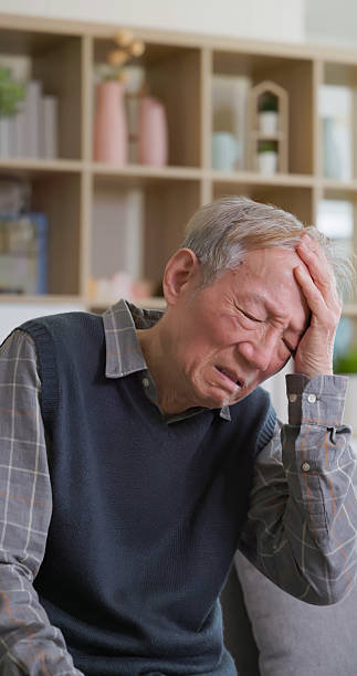 istock asian elderly headache dizzy home 2233022991