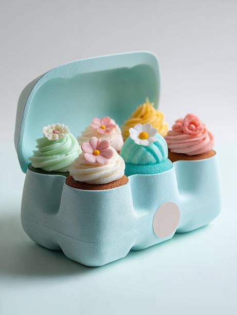 Delightful pink cupcakes in a decorative box for sweet celebrations and special occasions