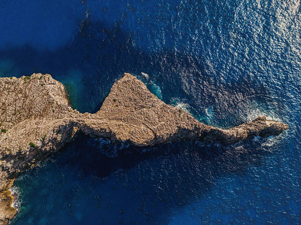 istock Rocky coastal arch formation. Menorca 2233028053