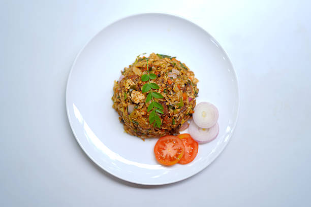 istock Vegetable Kottu with Tomato Slices, Onion Slices, and Curry Leaves. 2233030105