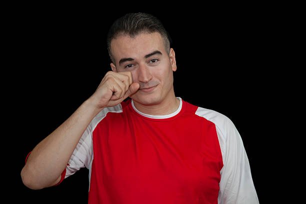 istock Tearful soccer player on black background 2233030752
