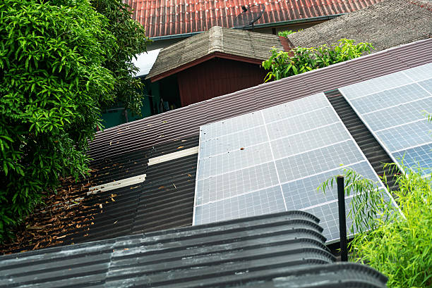 istock Solar Panels on Roofs Surrounded by Trees 2233031274