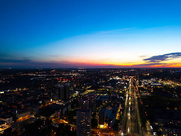 istock Panoramic evening view of an urban setting with illuminated structures and city lights 2233034905