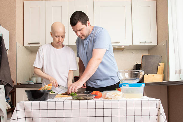 istock Young couple preparing dinner at home, teamwork in cooking process, fresh vegetables and healthy ingredients on table 2233034974