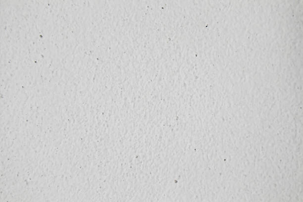 istock Picture of a white painted concrete wall with rough surface marks. 2233039032