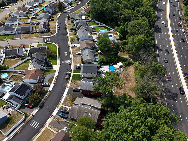 istock Suburban houses next to highway 2233039078